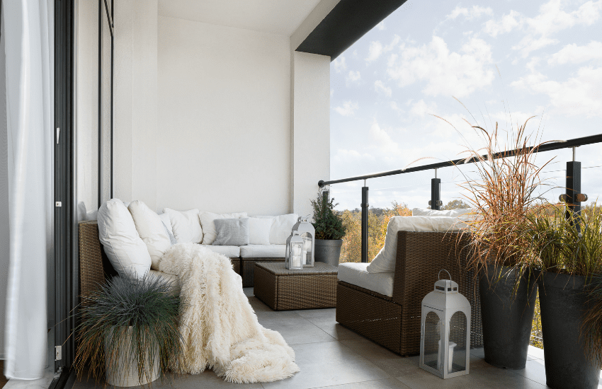 Brightly colored indoor rugs and cushions in a vibrant room setting.
