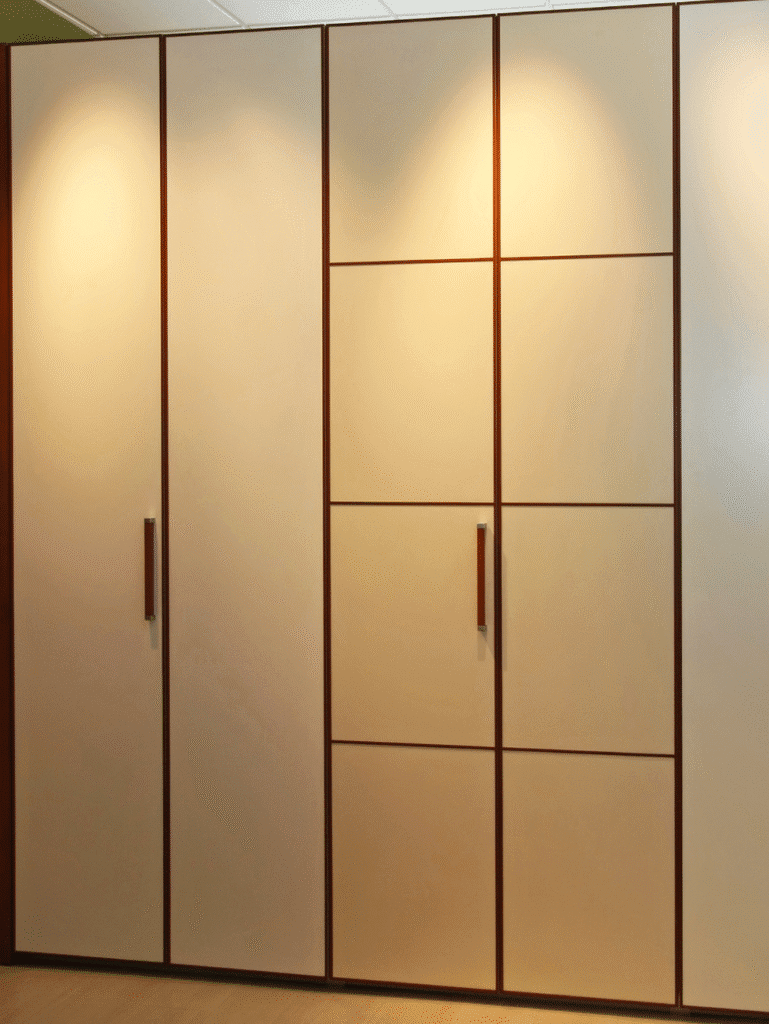 Customized Wardrobe with Smooth Beige Panels and Wooden Handles