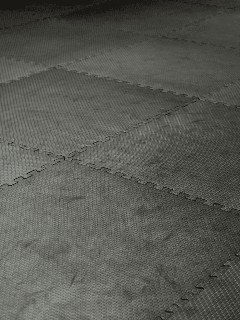 Durable garage flooring with interlocking tiles